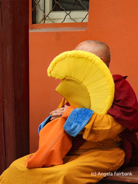 monk with yellow hat