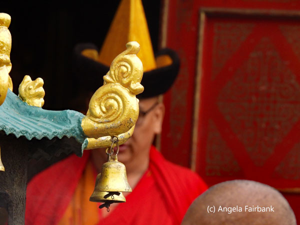 monk behind bell