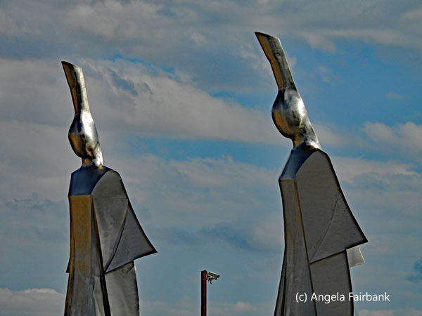 metal statues at entry to new province