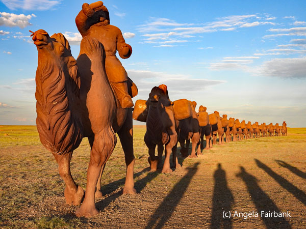 row of camel statues from front