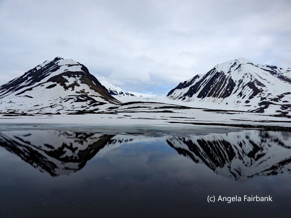 mountains reflected in water 2