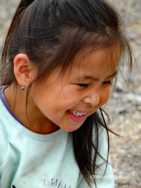 little girl outside restaurant