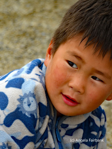 little boy outside restaurant