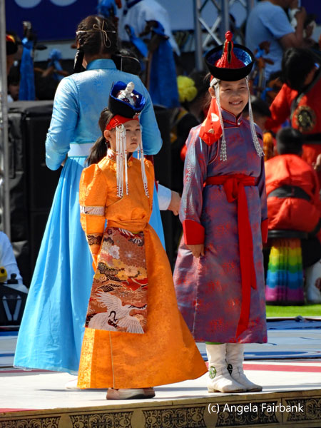 children in orange and red