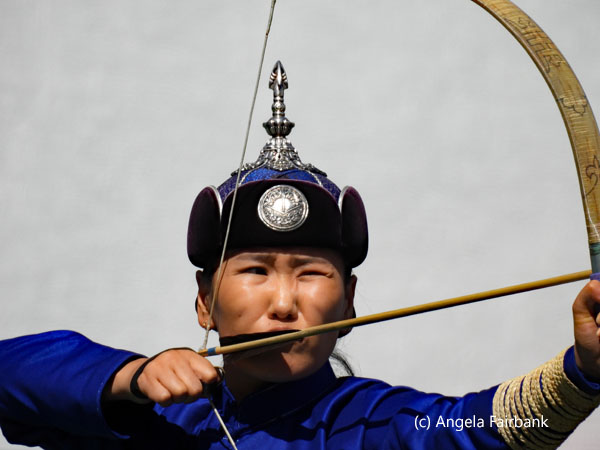 female archer in blue