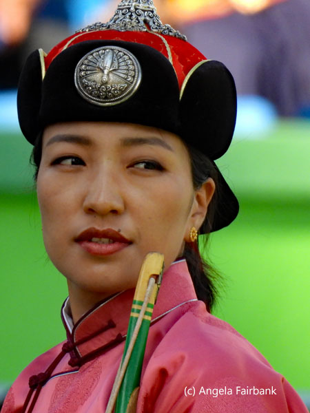 female archer in pink