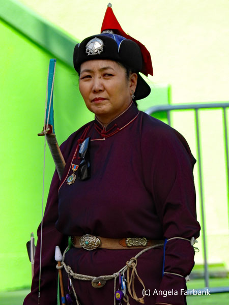 female archer in purple