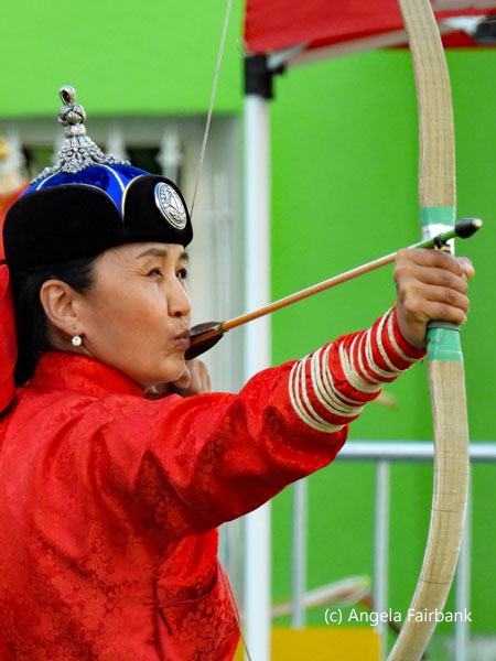 female archer in red