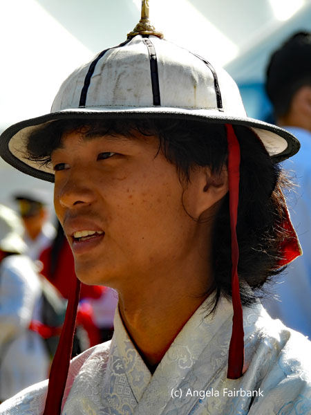 young man in white hat