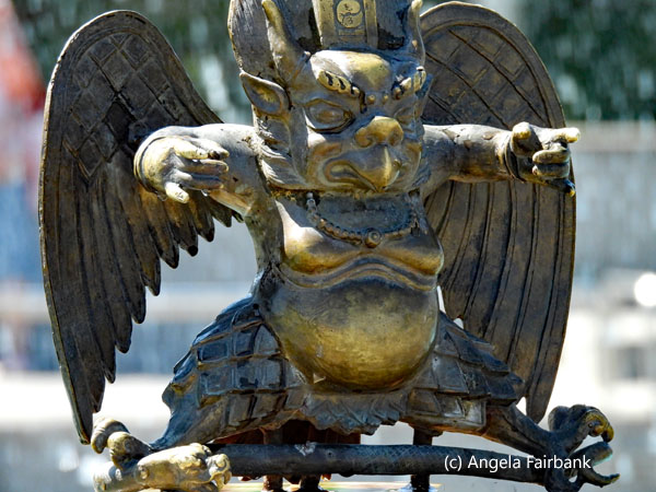 winged creature in bronze