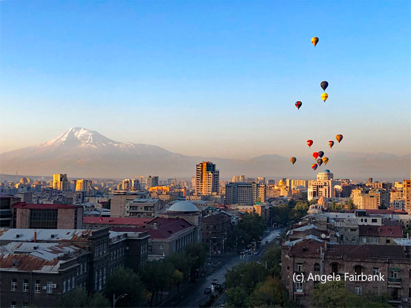 view of Mount Ararat and hot air balloons