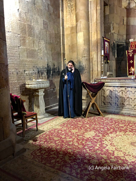 priest inside Noravank Monastery 1
