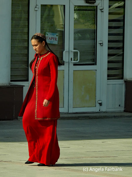 young female worker in red uniform