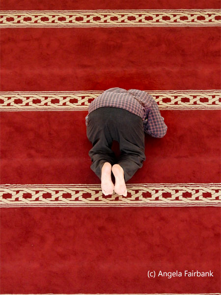 man praying in main mosque