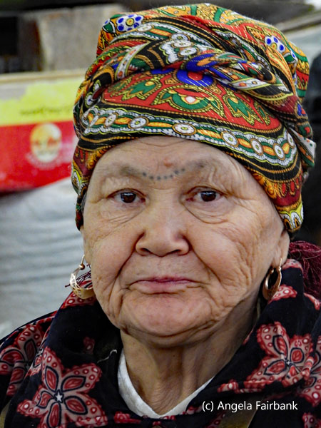 tatooed woman at market