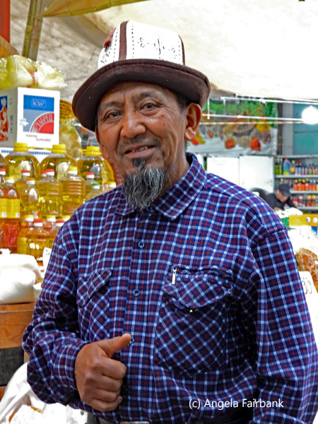man in hat at market