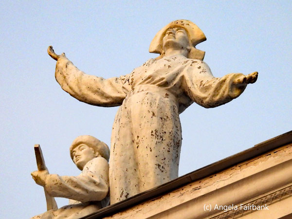 statues atop theatre building