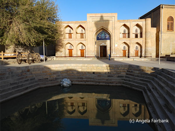 building and pond in old town Bukhara