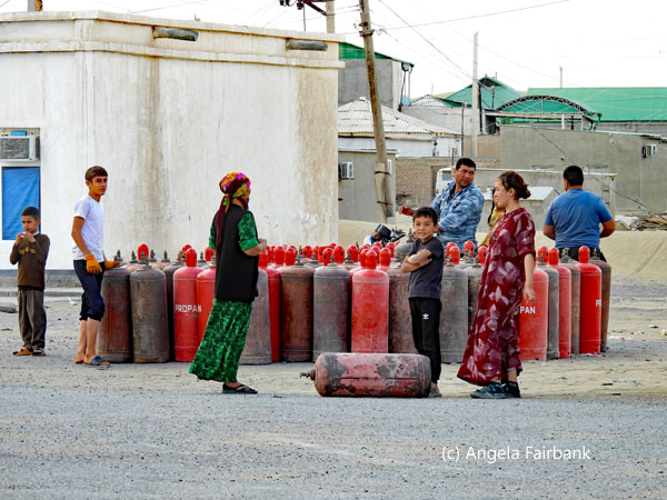 group of villagers with canisters