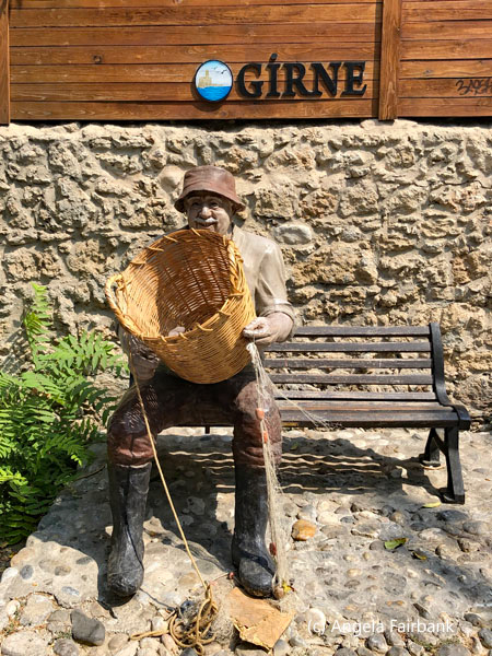 basket weaver on bench