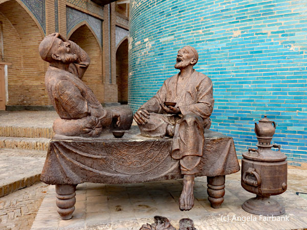 sculpture of two men laughing
