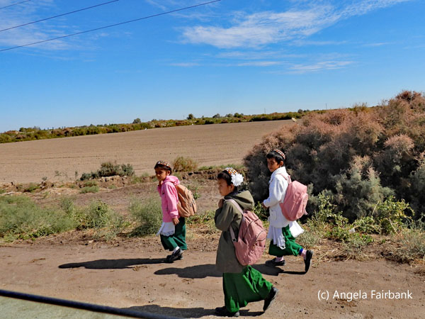 3 school children walking