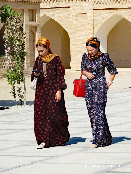 two young women crossing square at Askhabs