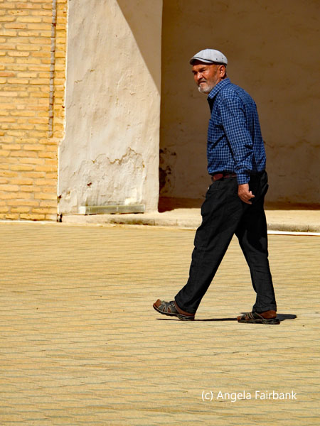 man crossing square at Askhabs