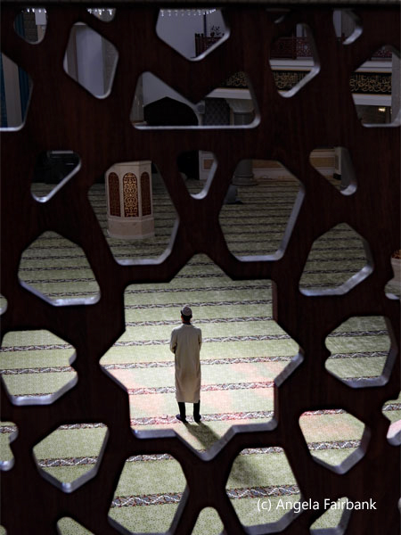 view of man praying from women area of mosque 4
