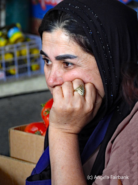 midle-aged woman in black headscarf