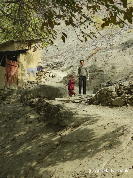 boy and sister on side of road