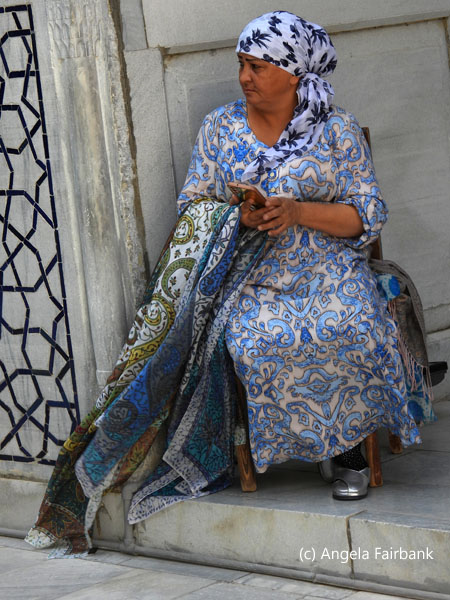 scarf vendor in blue