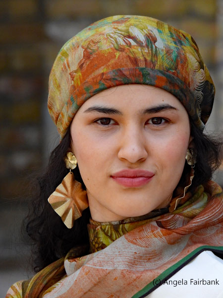 young woman with large gold earrings