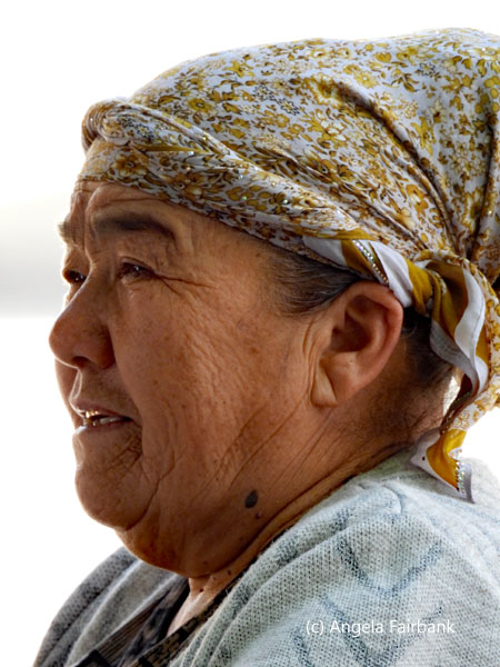 smiling woman facing left
