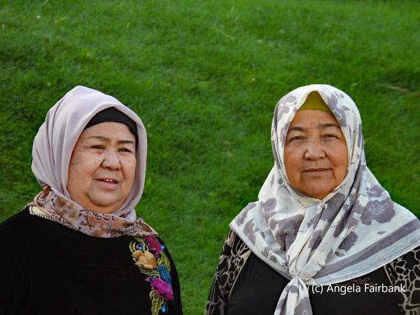 2 elderly ladies in headscarfs facing front
