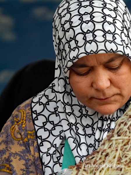woman in black and white headscarf