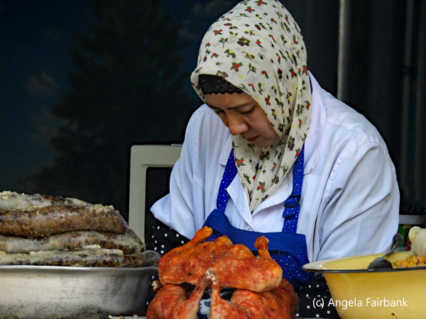 woman selling barbecued chicken