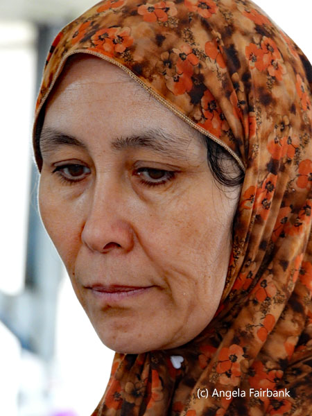woman in orange headscarf
