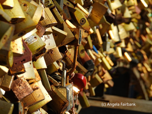 gold locks on bridge