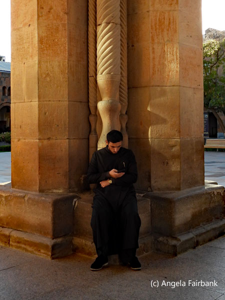 monk with cell phone at Echmiadzin Cathedral