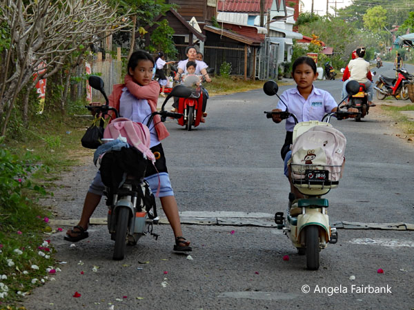 school children on scooters