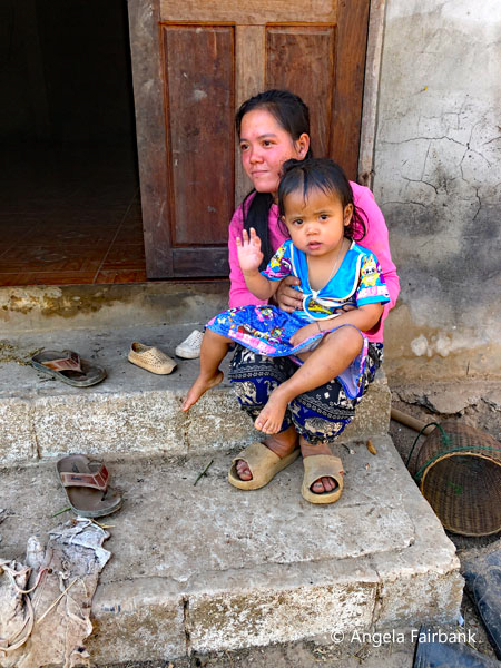 woman and waving baby