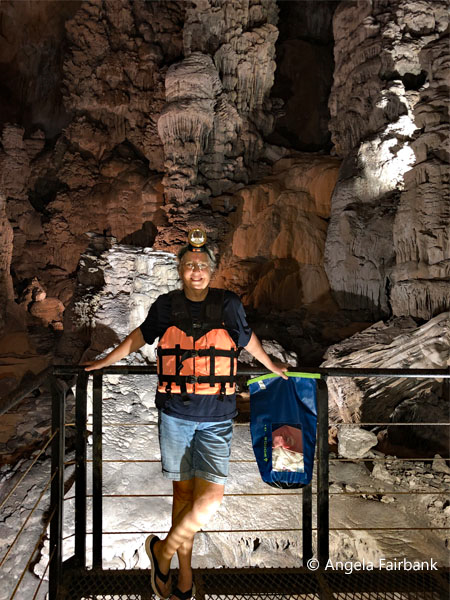 me inside cave with lifevest and headlamp