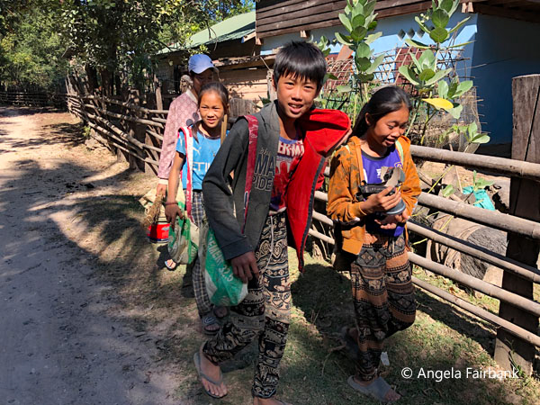 Phu Thai teenagers arriving home from school