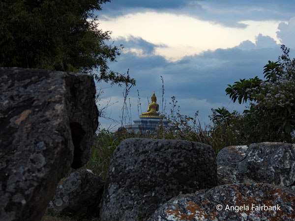 sunset at plain of jars 5 with golden buddha