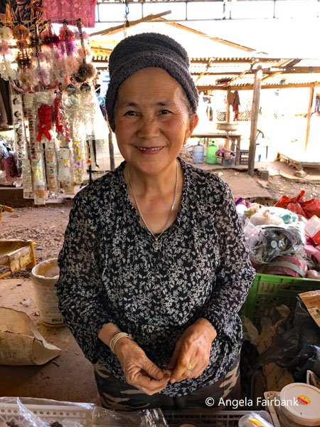 elderly hmong woman at market 2