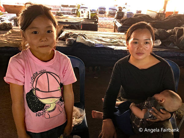 woman with two children at hmong market