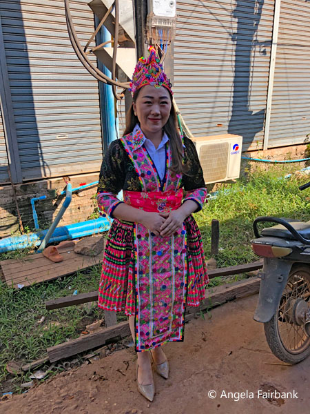young hmong woman in traditional dress posing