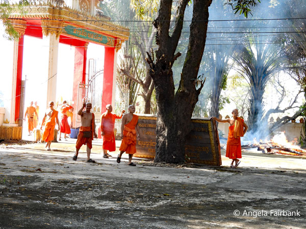 monks walking into religious complex