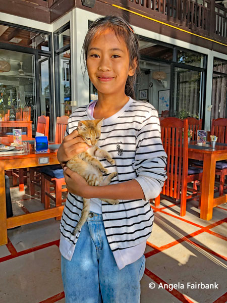young waitress at our hotel with kitten